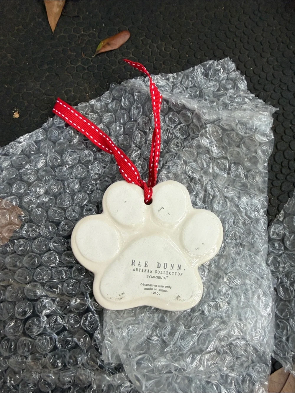 Rae Dunn Cream 'Ruff Life' Dog Paw Ornament with Red Ribbon